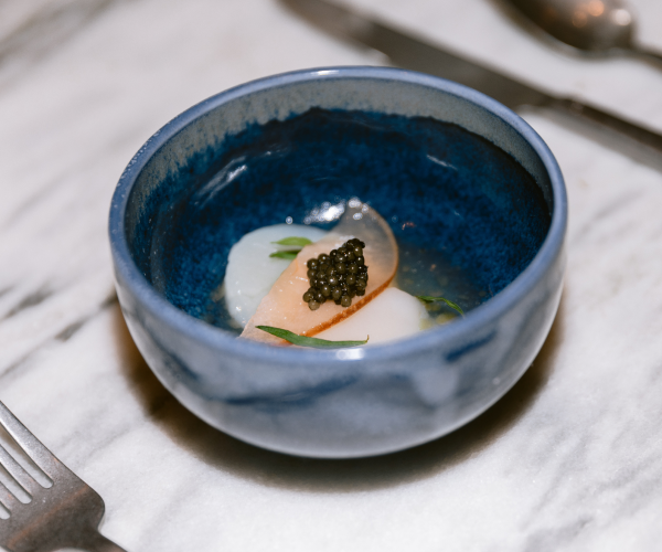 caviar fish dish in a blue bowl